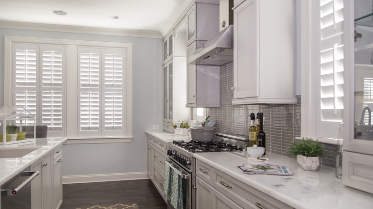 White shutters in Hartford kitchen with modern appliances.